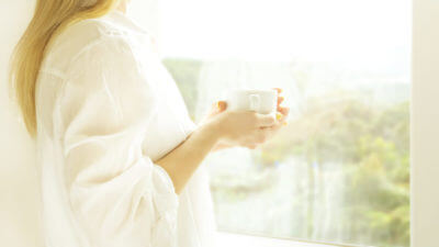 Are Your Windows Protecting You from UV Rays? - girl at sunny window